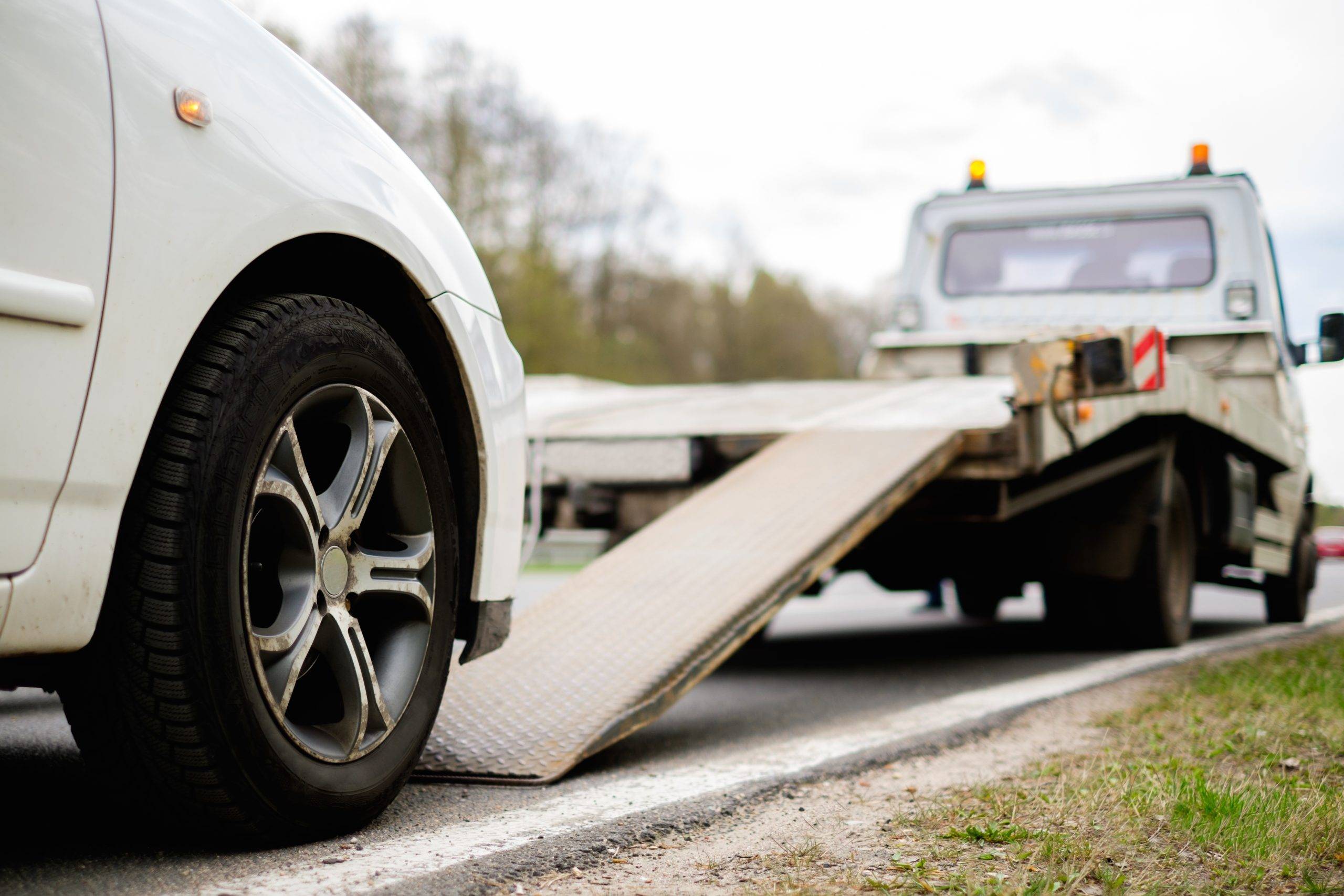 Loading Broken Car On A Tow Truck On A Roadside Loading Broken Car On A Tow Truck On A Roadside